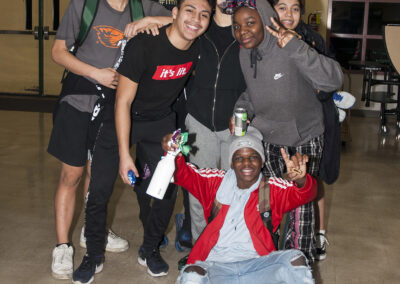 A grou p of high school students pose in front of the camera with smiles